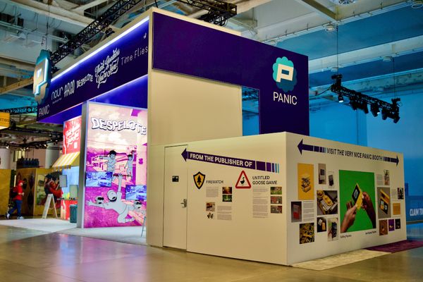 The Panic PAX West booth in 2023, showing Despelote, and the rear staff/media room, which features the stories of Panic and Playdate