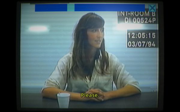 Screenshot from Her Story, showing a woman's police interview footage, with text overlays showing the date and time, and subtitles that say Please